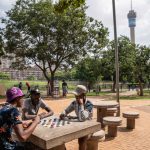 15 January 2020: A game of draughts being played with bottle tops at Barnato Park in the Johannesburg suburb of Berea.