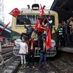 8 January 2020: Communist Party of India (Marxist) supporters blocking a passenger train during an anti-government protest rally organised as part of a nationwide strike by various trade unions in Kolkata, India. (Photograph by Reuters/Rupak De Chowdhuri)