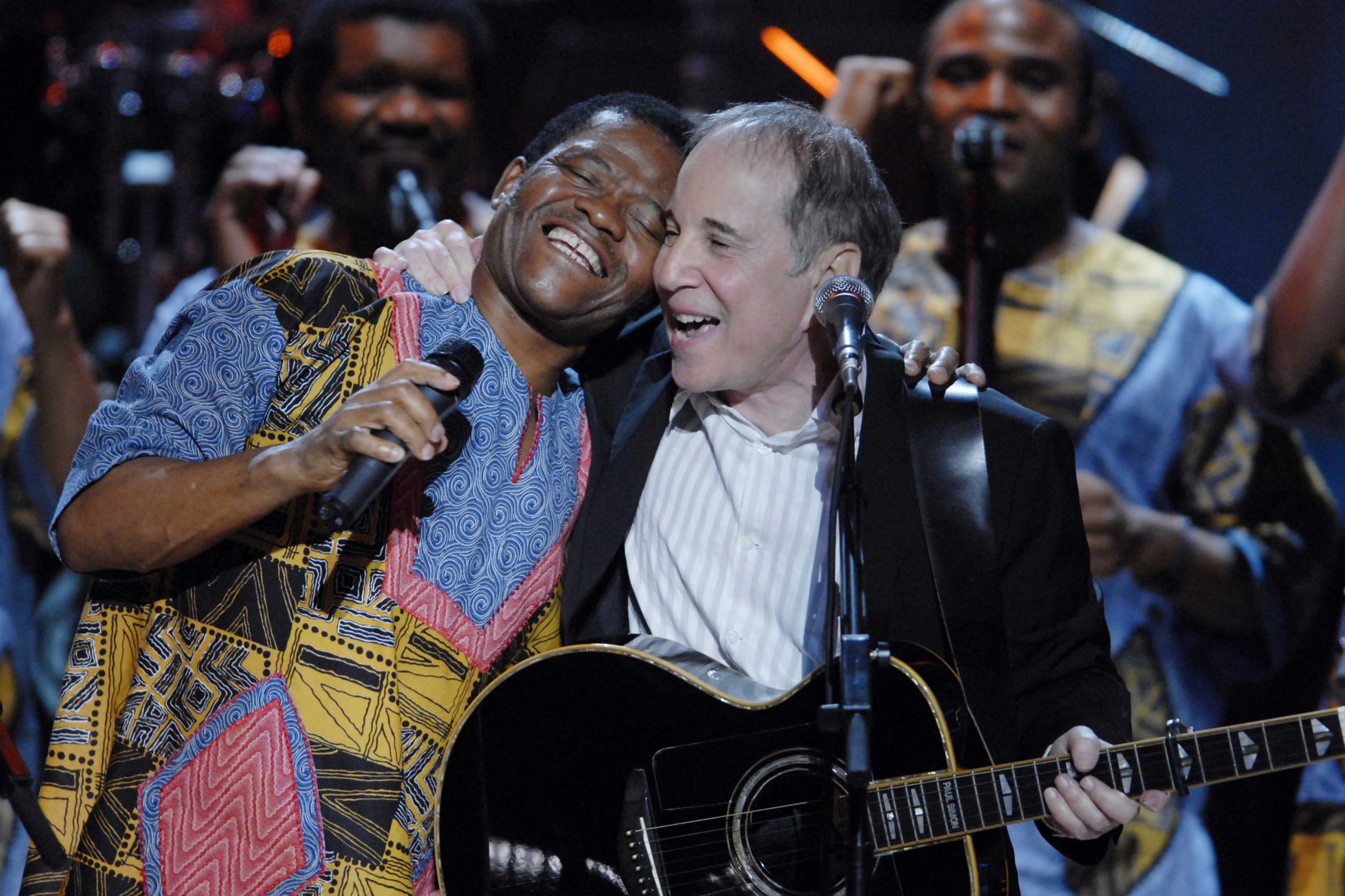 23 May 2007: Paul Simon with Ladysmith Black Mambazo at the Warner Theatre in Washington, DC. They worked with him on his 1986 album Graceland, co-writing Homeless, which has a melody based on a Zulu wedding song. (Photograph by Scott Suchman/WireImage)