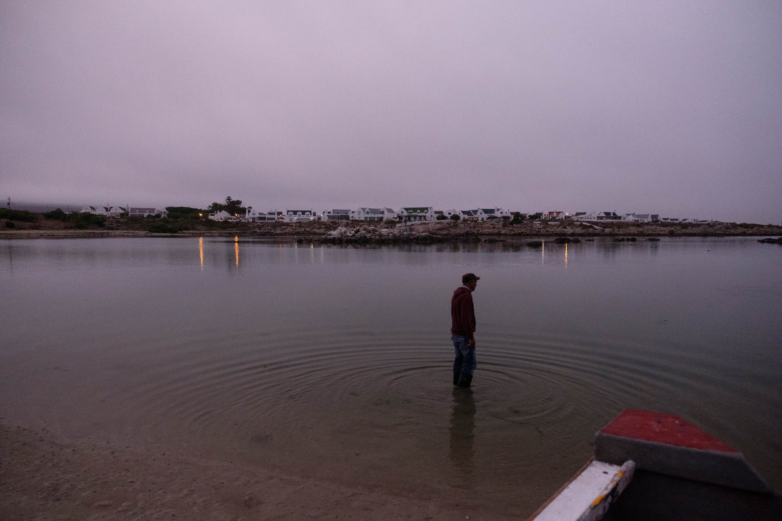 06 December 2019: Christian Adams in the water at Jacobsbaai looking for the ideal launch point for his boat.