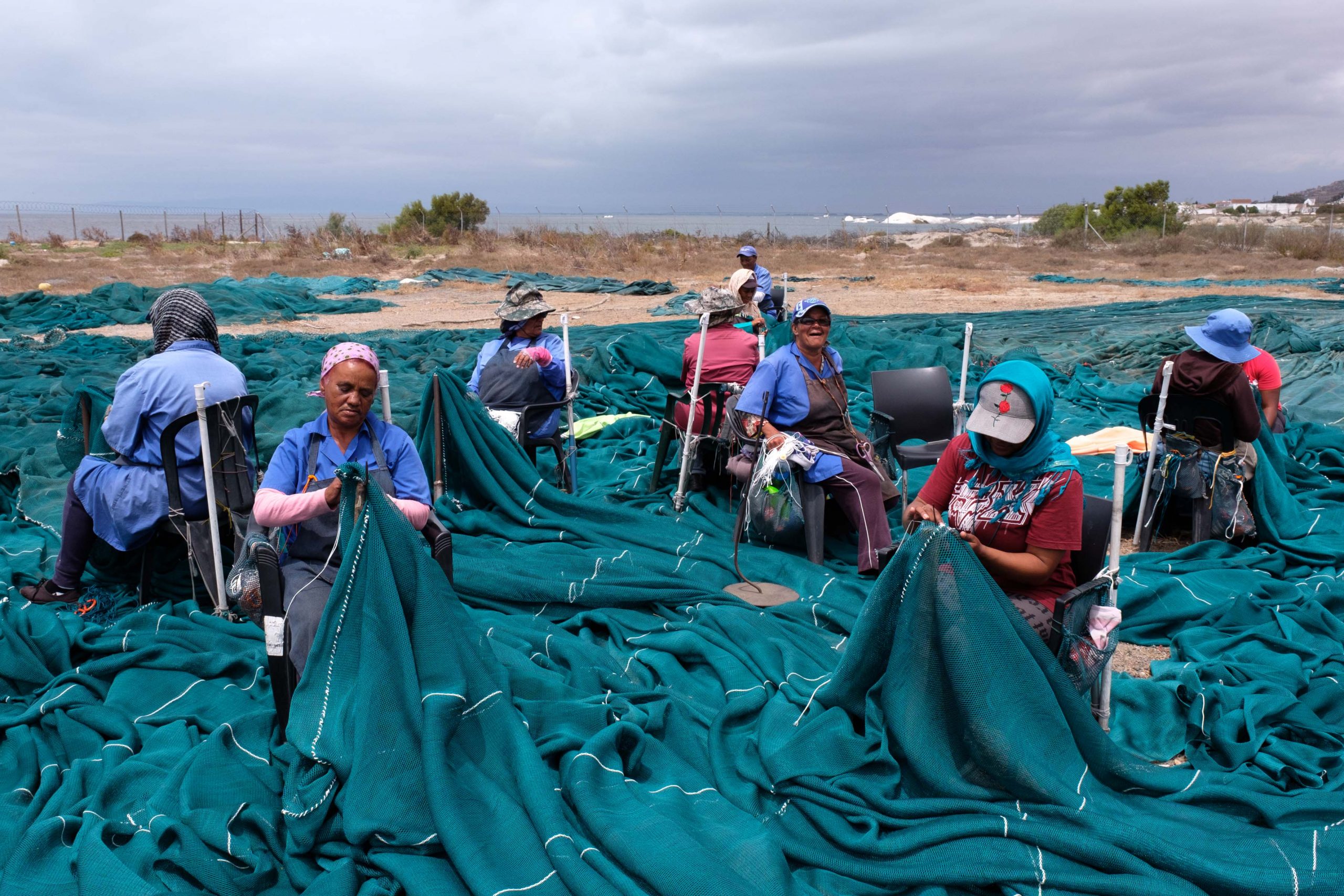 22 January 2020: Women repair the surfaces of the fishing nets while the heavier work of fixing the seams is left to men. 