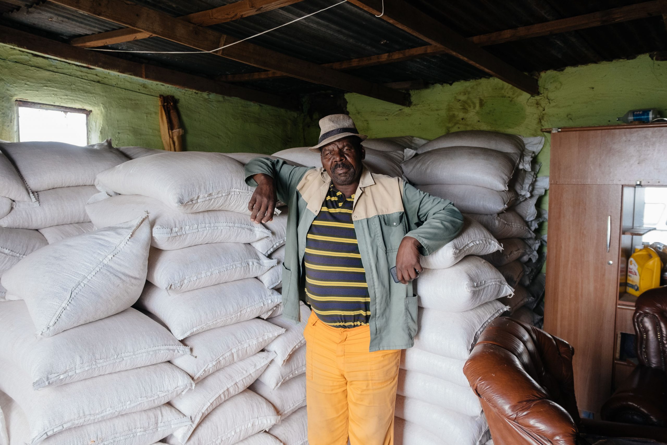 12 December 2019: Lulama Kapa in his grain store. He and his wife Nothandekile Kapa decided against planting crops this year because of uncertainty over the lease for their land. 