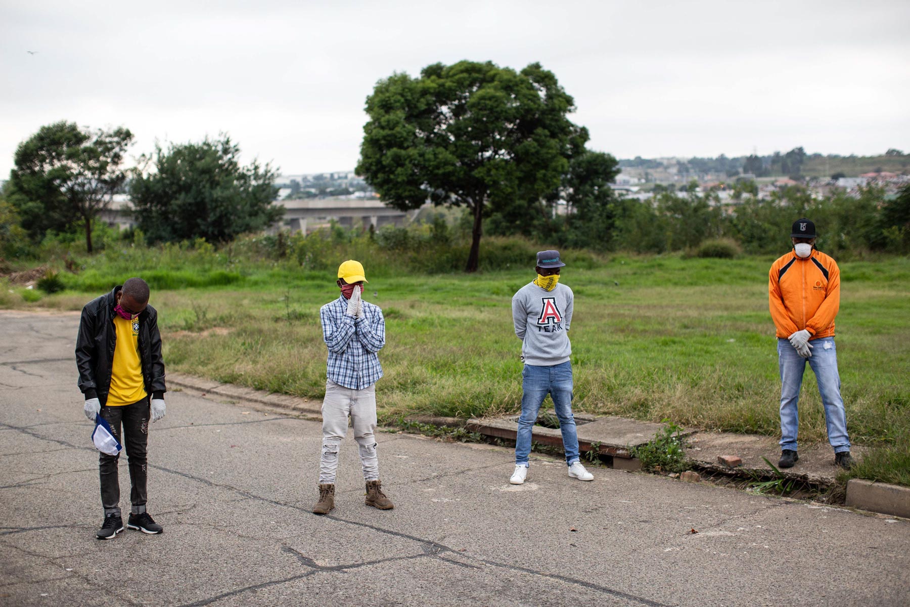 8 April 2020: Rays of Hope volunteers pray before setting out on their Alex food distribution route.