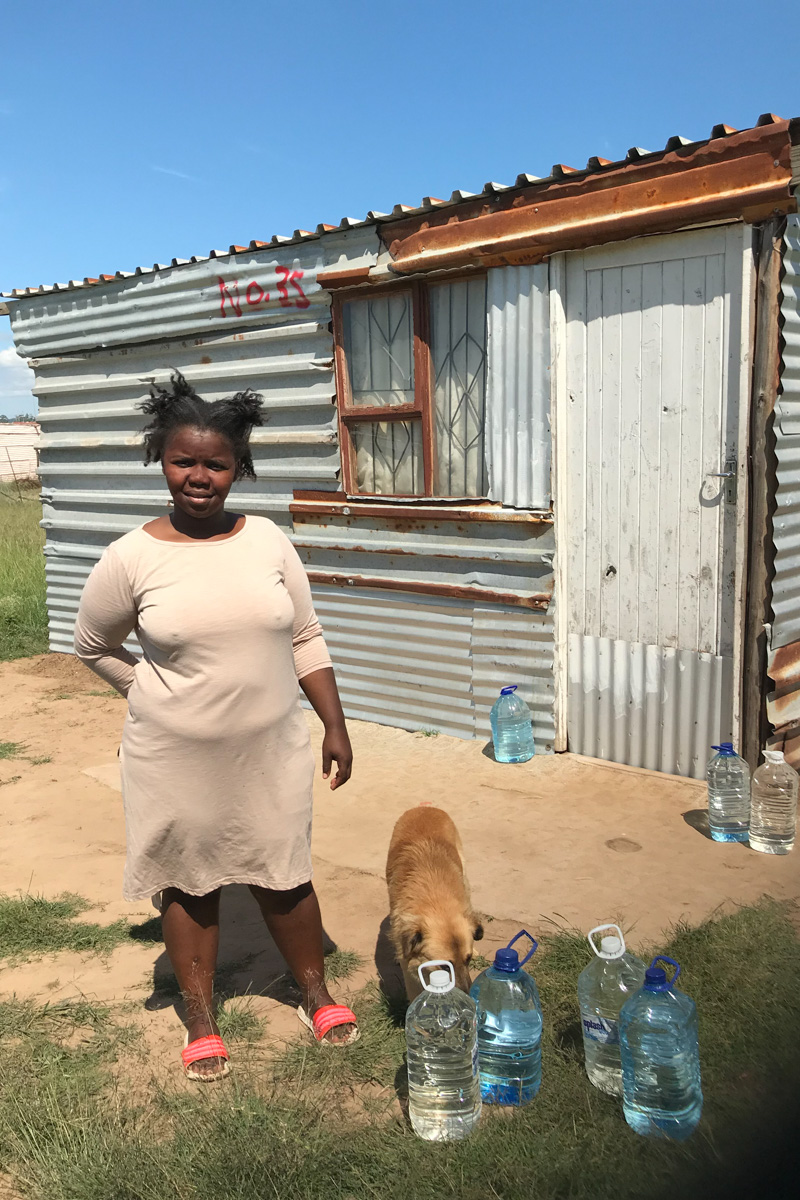 25 March 2020: Ntombovuyo Salman, who lives in Nkanini outside Makhanda, collects water from an exposed water pipe each time the few taps in the area run dry.