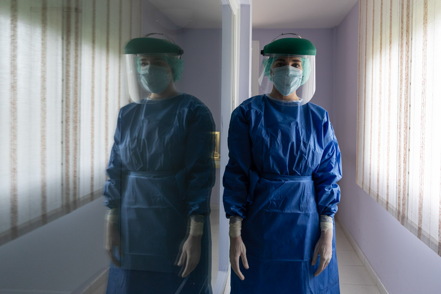 27 April 2020: A government nurse poses after conducting Covid-19 tests on care workers replacing staff members at the Los Monegros nursing home in Huesca, Spain, who have been confined there since 30 March. (Photograph by Alvaro Calvo/ Getty Images)