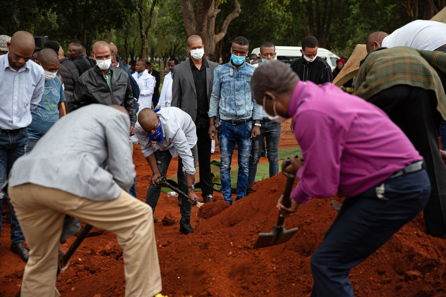 28 March 2020: A police officer counted those attending Angel’s burial at West Park Cemetery, allowing no more than 50 people to the graveside in line with government regulations amid the Covid-19 lockdown. 
