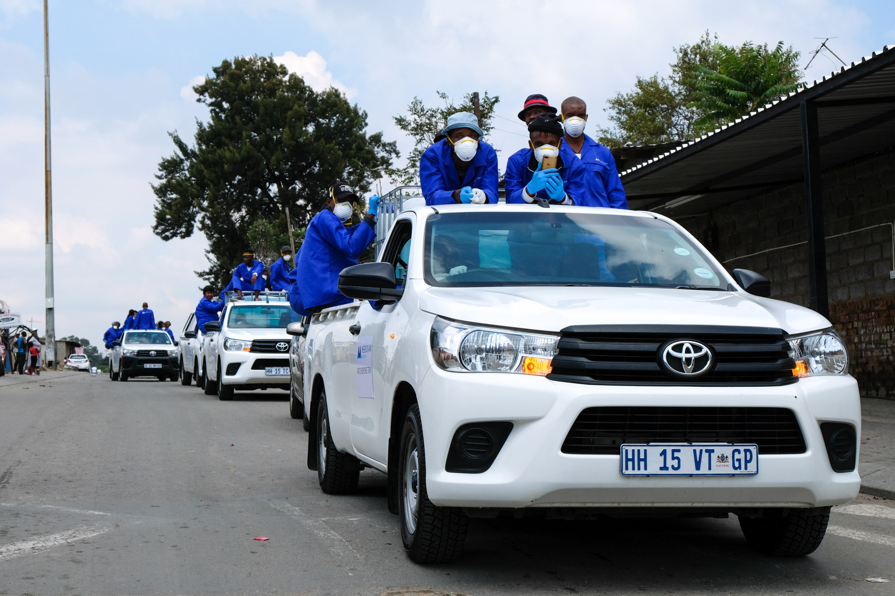 2 April 2020: Meridian Hygiene sanitation workers make their way through Alex. 