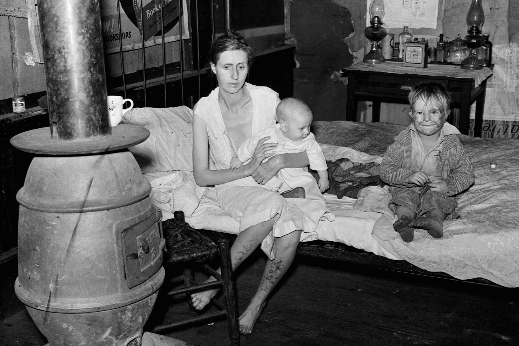 1938: The wife and two children of an unemployed mine worker living in an abandoned mining town in Marine, West Virginia. She is suffering from both tuberculosis and syphilis. (Photograph by Corbis/ Corbis via Getty Images)
