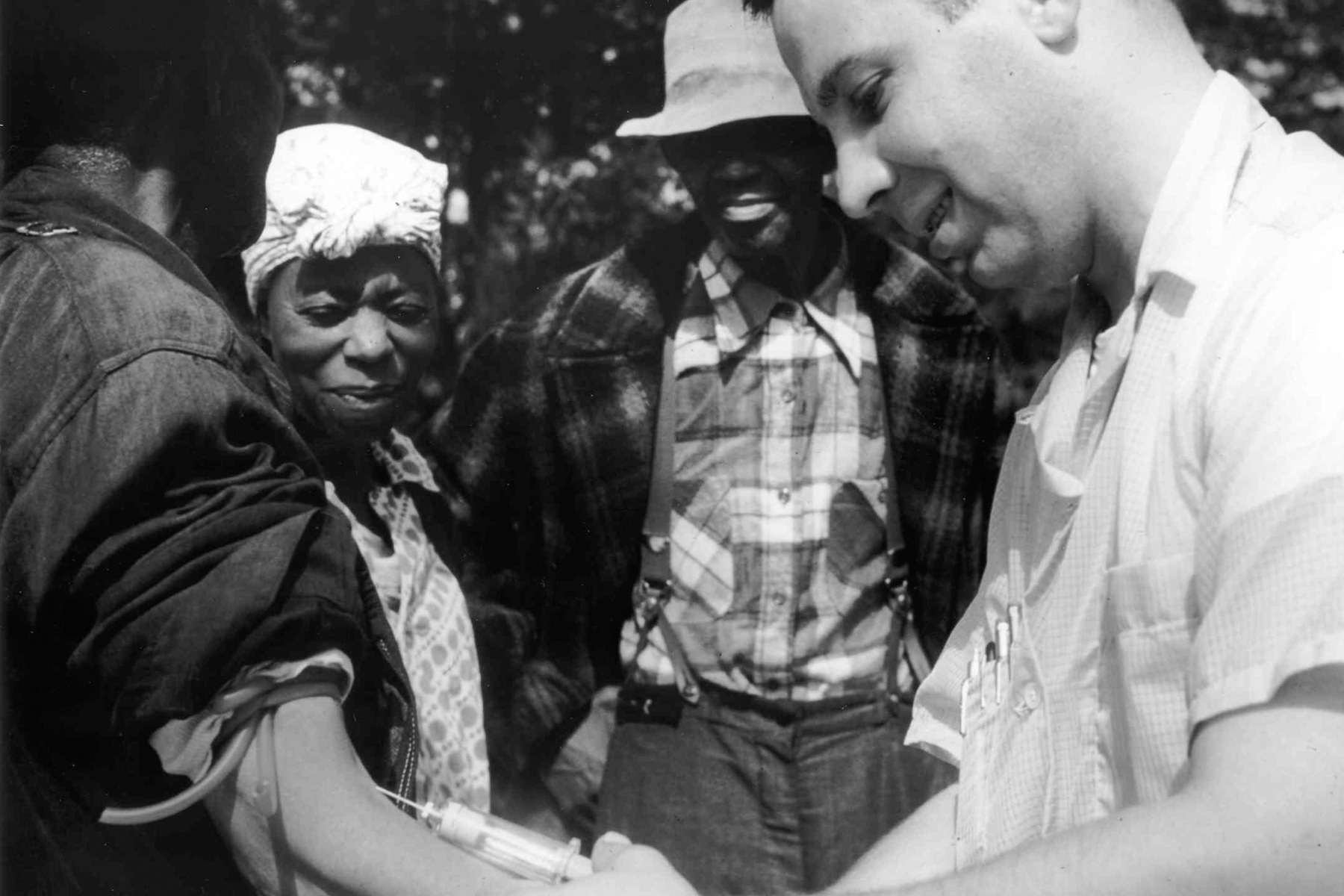 1932: A doctor draws blood from a patient as part of the Tuskegee Syphilis Study. (Photography by Wikimedia Commons/ US National Archive) 