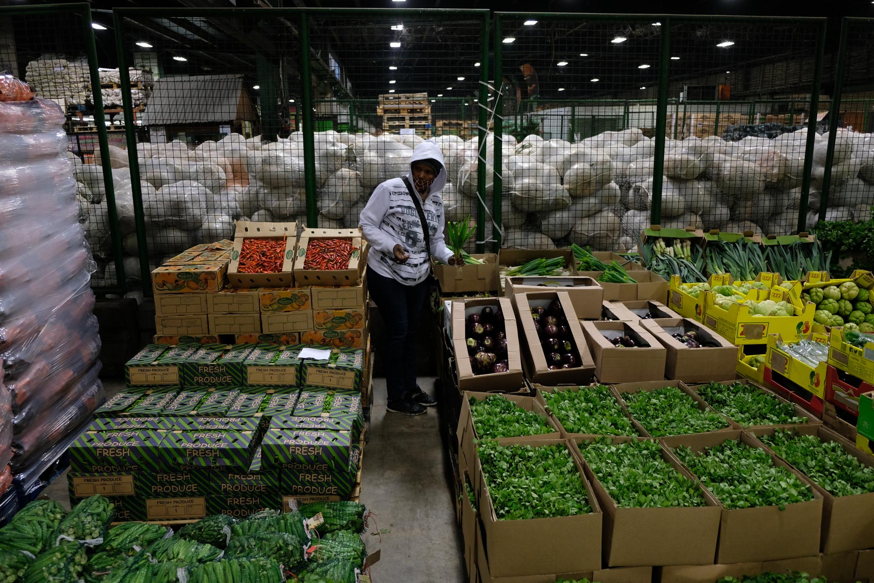 8 May 2020: Mercy Mokgehle perusing fresh produce at the City Deep fresh produce market.