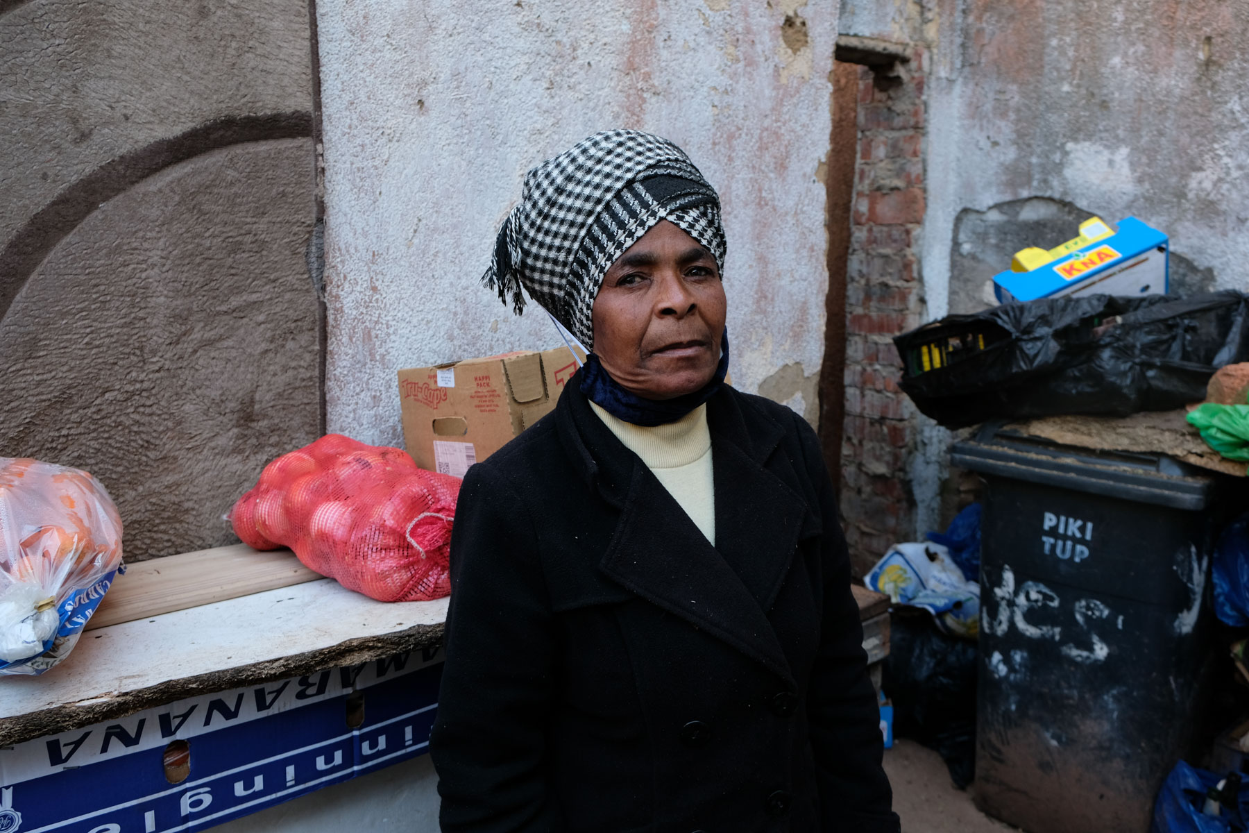 8 May 2020: Linah Malefahlo with some of the fresh produce that has started to rot in her yard since she was forced off the sidewalks, where she ordinarily trades for a living.