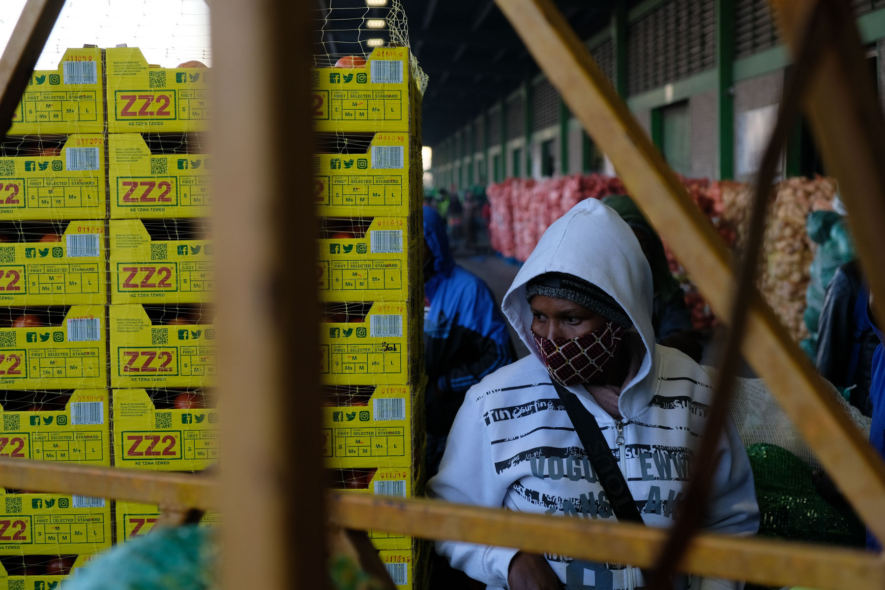 8 May 2020: Mercy Mokgehle oversees the loading of her stock on a bakkie to be transported to her stall at the Yeoville Market.