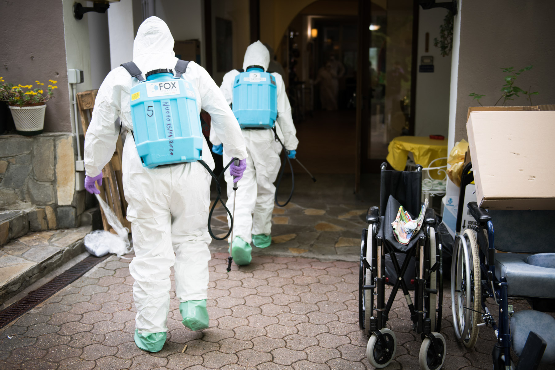 30 April 2020: Italian soldiers disinfect a home for the elderly in Turin, Italy, during the Covid-19 pandemic. (Photograph by Stefano Guidi/ Getty Images)