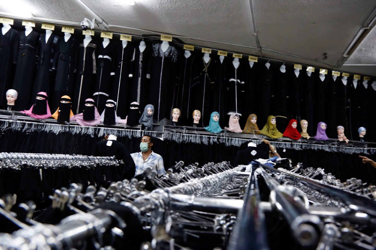 18 May 2020: A Yemeni man wears a protective face mask while shopping ahead of Eid al-Fitr in Sana'a, Yemen. (Photograph by Mohammed Hamoud/ Getty Images)