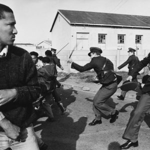 1985: South African police officers charge a group of United Democratic Front demonstrators as they march to Pollsmoor Prison in Cape Town in an attempt to free political prisoners. (Photograph by Gideon Mendel/ Corbis via Getty Images)