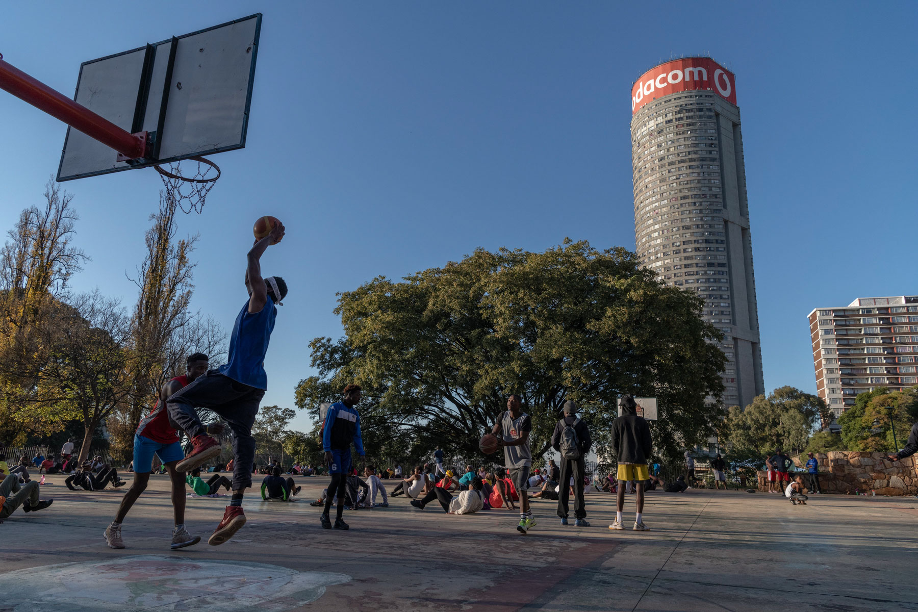 12 May 2020: An early morning game of basketball played in the shadow of Ponte Tower. 