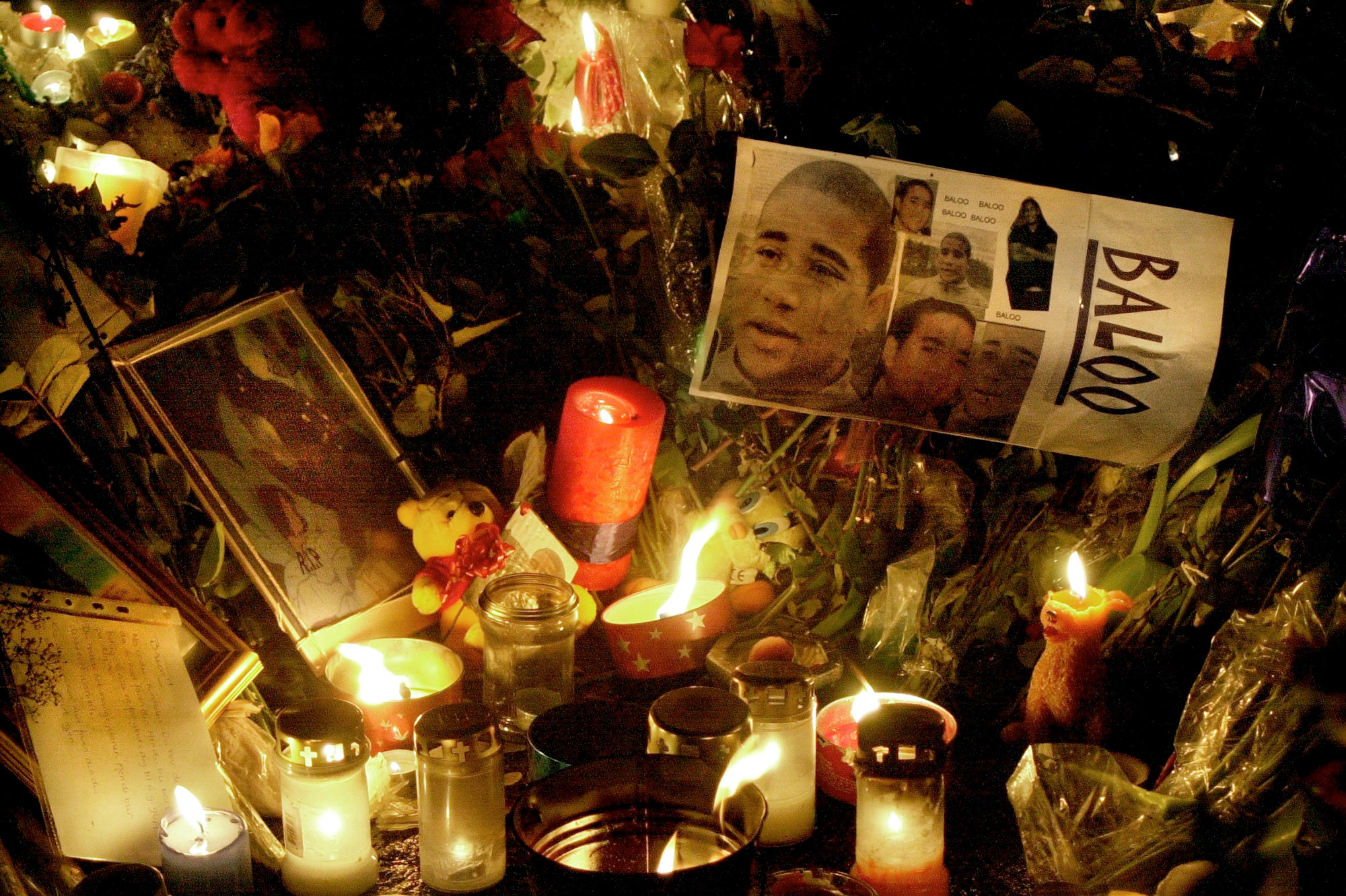 28 January 2001: Photos and candles cover the ground at the spot where Benjamin Hermansen was knifed and killed in a racially motivated attack. (Photograph by Jeanette Landfald/ All Over Press Norway/ Liaison)