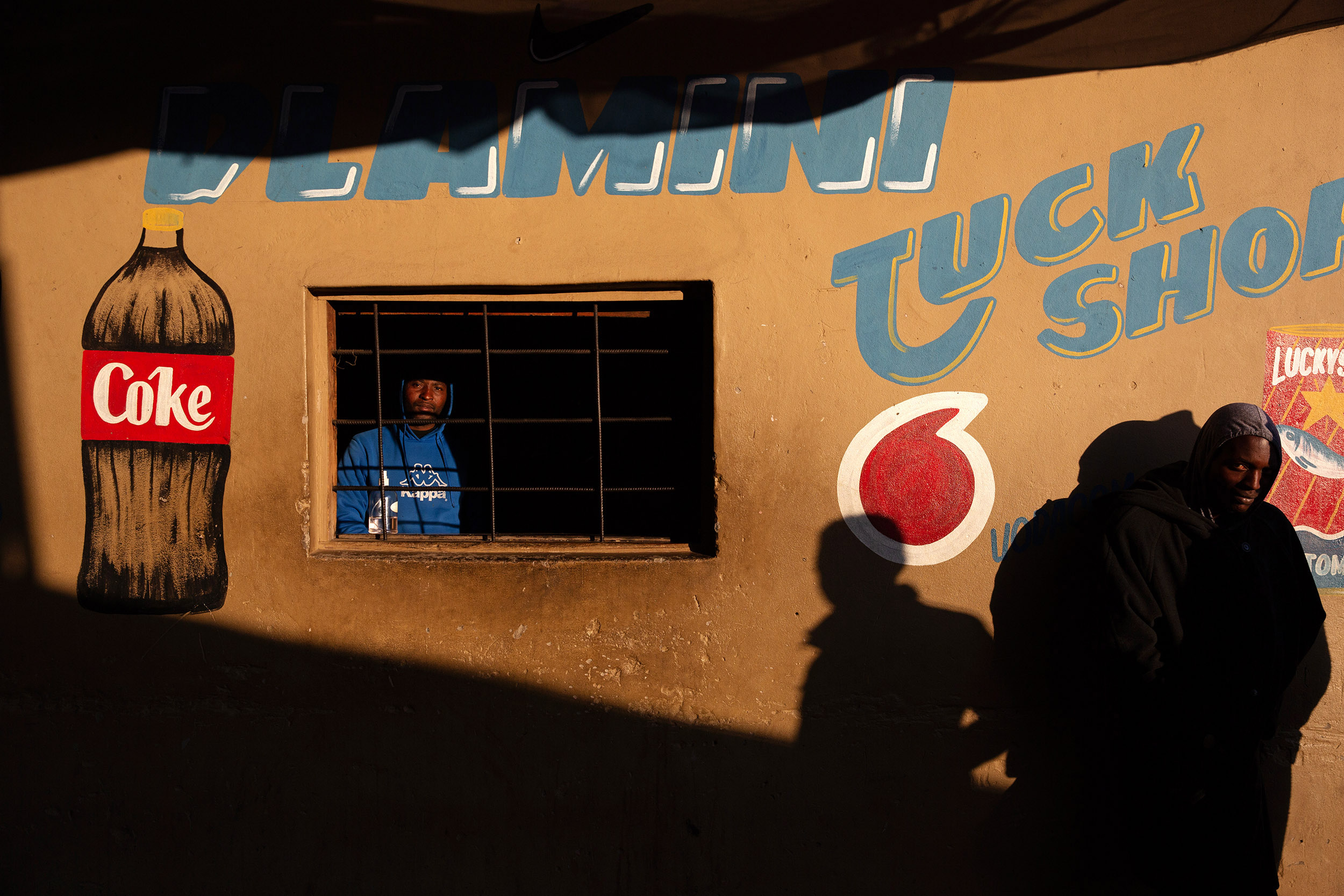 9 July 2020: Sidwell Dlamini from Msinga in KwaZulu-Natal runs a tuckshop in Makause shack settlement. Although foot traffic is sparse, street traders and shop owners are starting to make ends meet. 