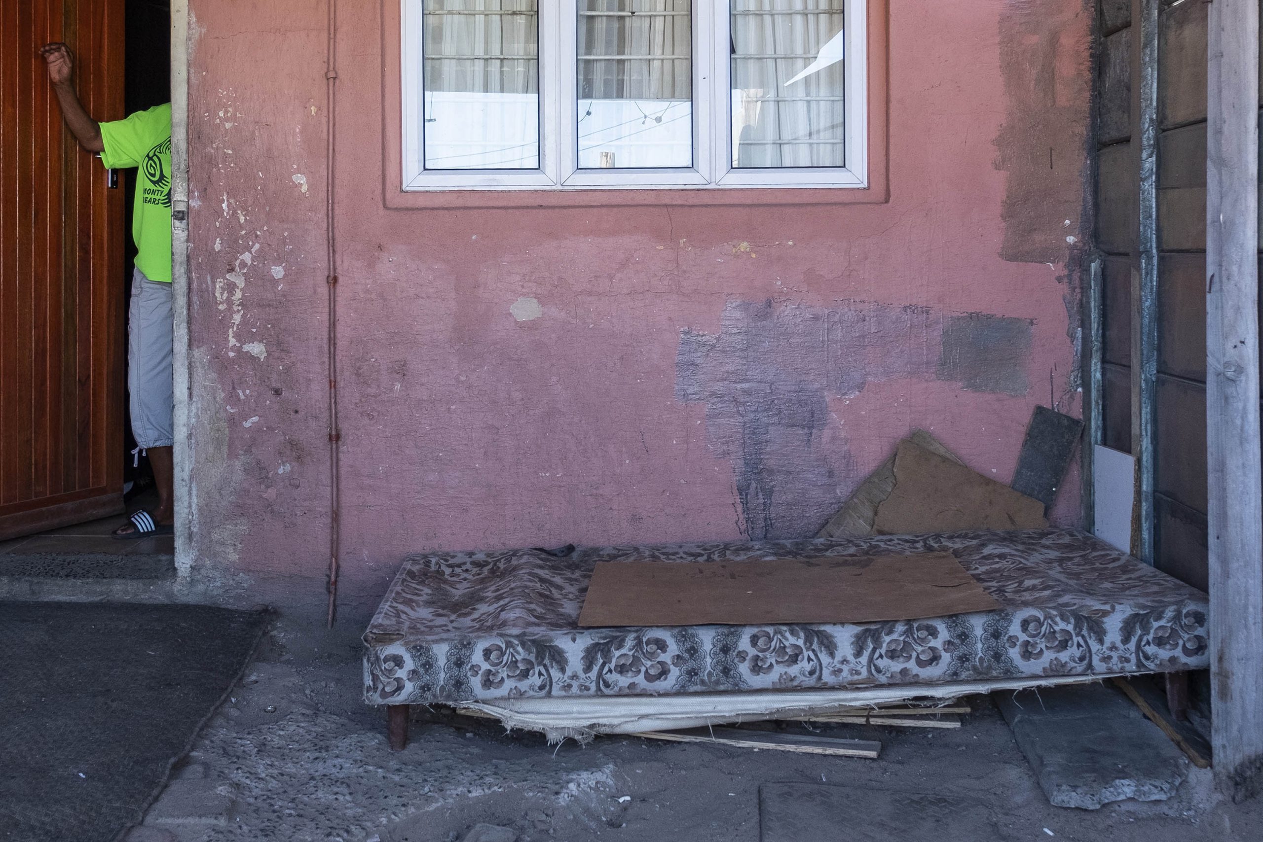 2 April 2020: When Petrus Miggels got home after being assaulted, he told Valene Meintjies what had happened and went to sit on this mattress that lies on the floor just outside their front door.