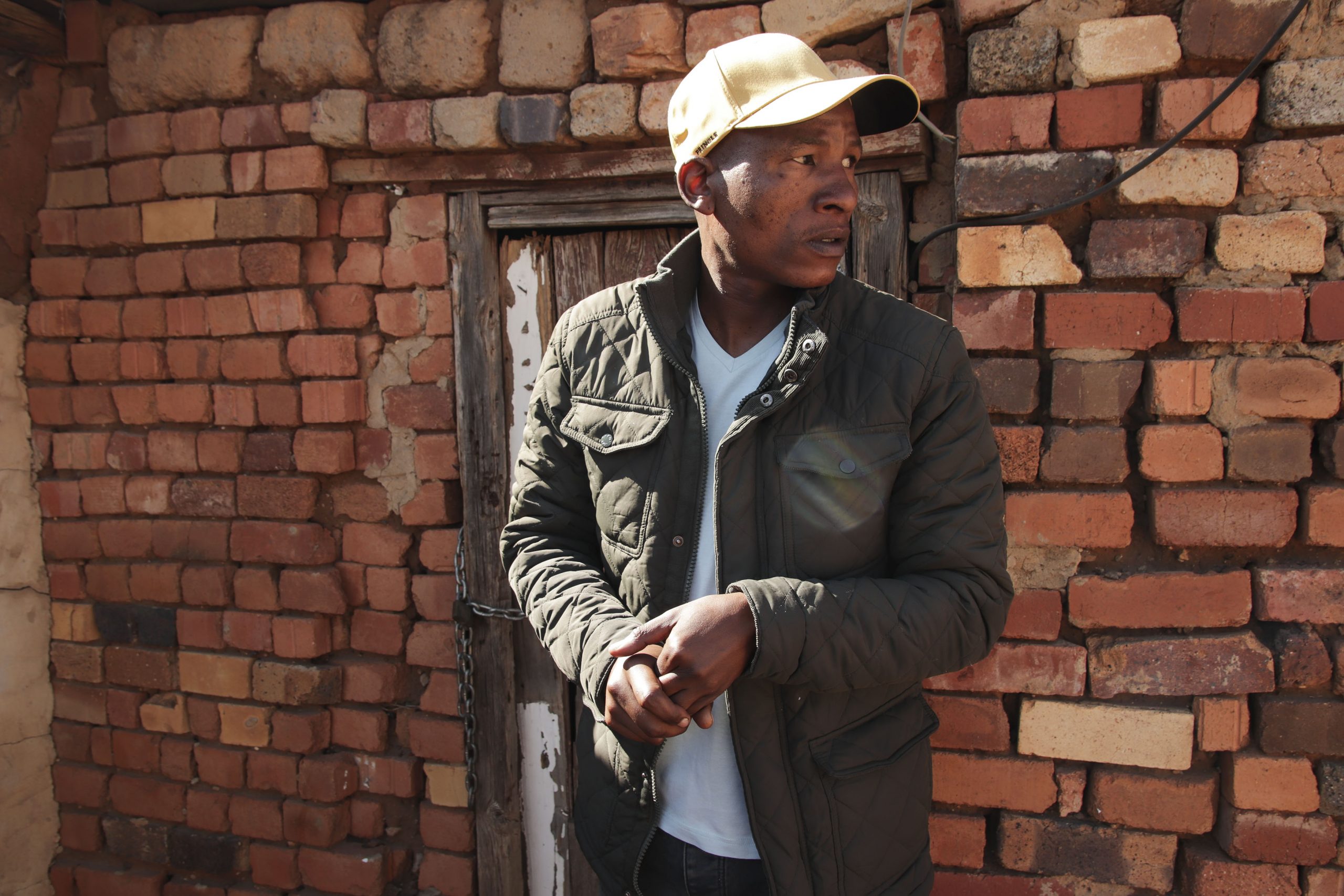 19 July 2020: Andrew Babeile stands in front of the house in the township of Huhudi, Vryburg, where he was born. (Photograph by Gaoretelelwe Molebalwa)