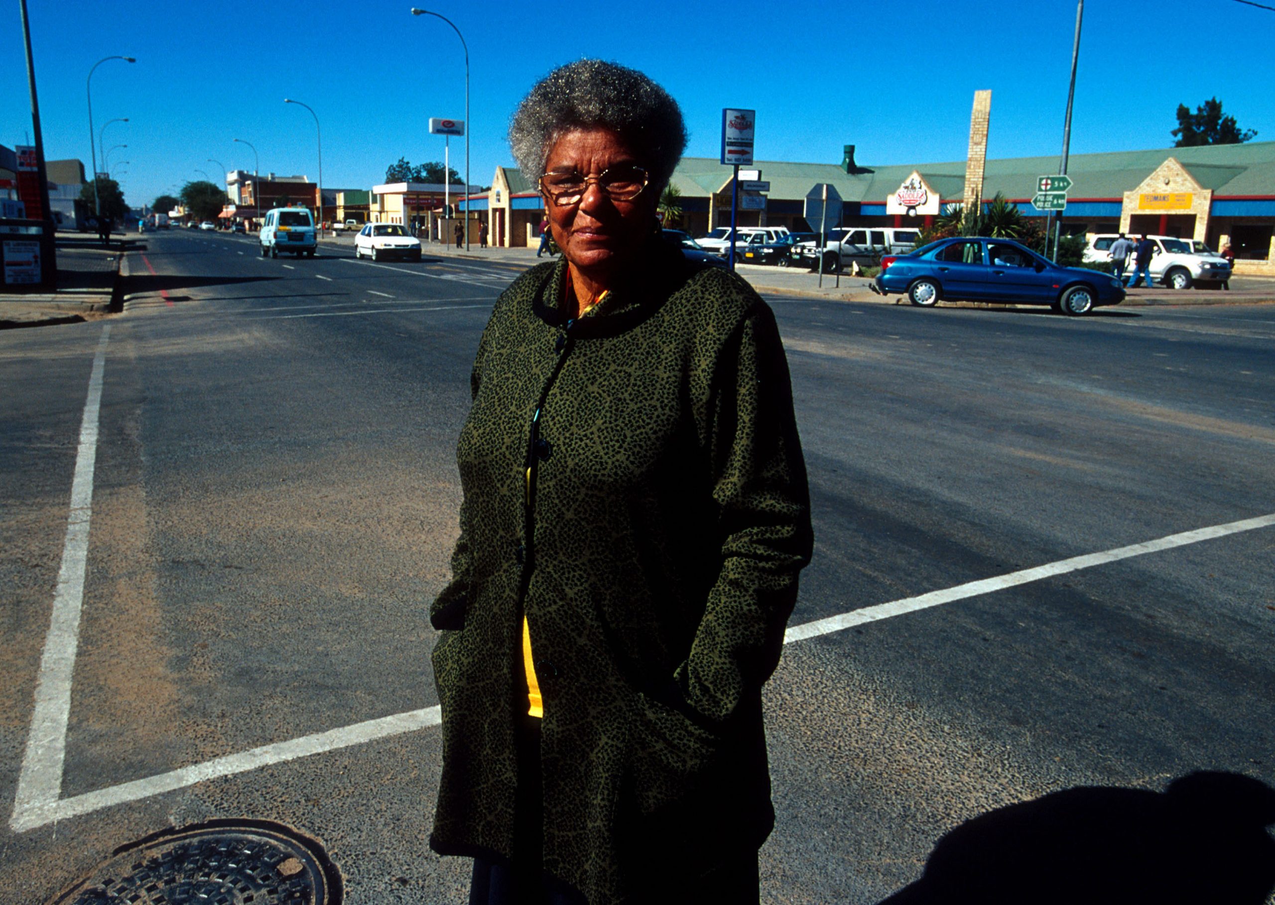 19 June 2001: Ruth Mompati, the first black mayor of Vryburg, takes a walk in the town centre. A former teacher at black schools in the district, she had intimate knowledge of pupils’ struggles. (Photograph by Per-Anders Pettersson/ Getty Images)