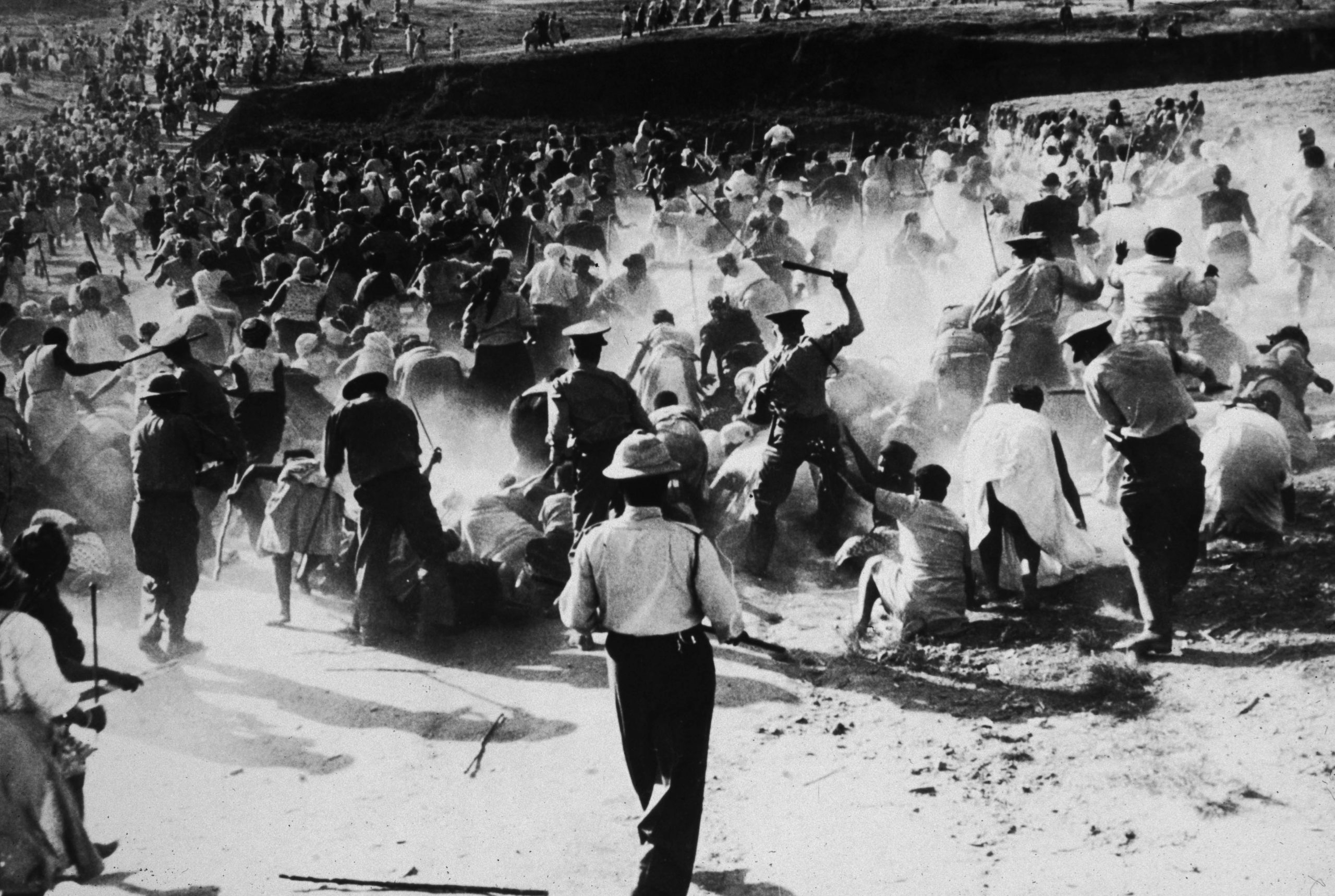 1959: South African police officers beat black women with clubs during a protest against apartheid in Durban. (Photograph by Hulton Archive/ Getty Images)