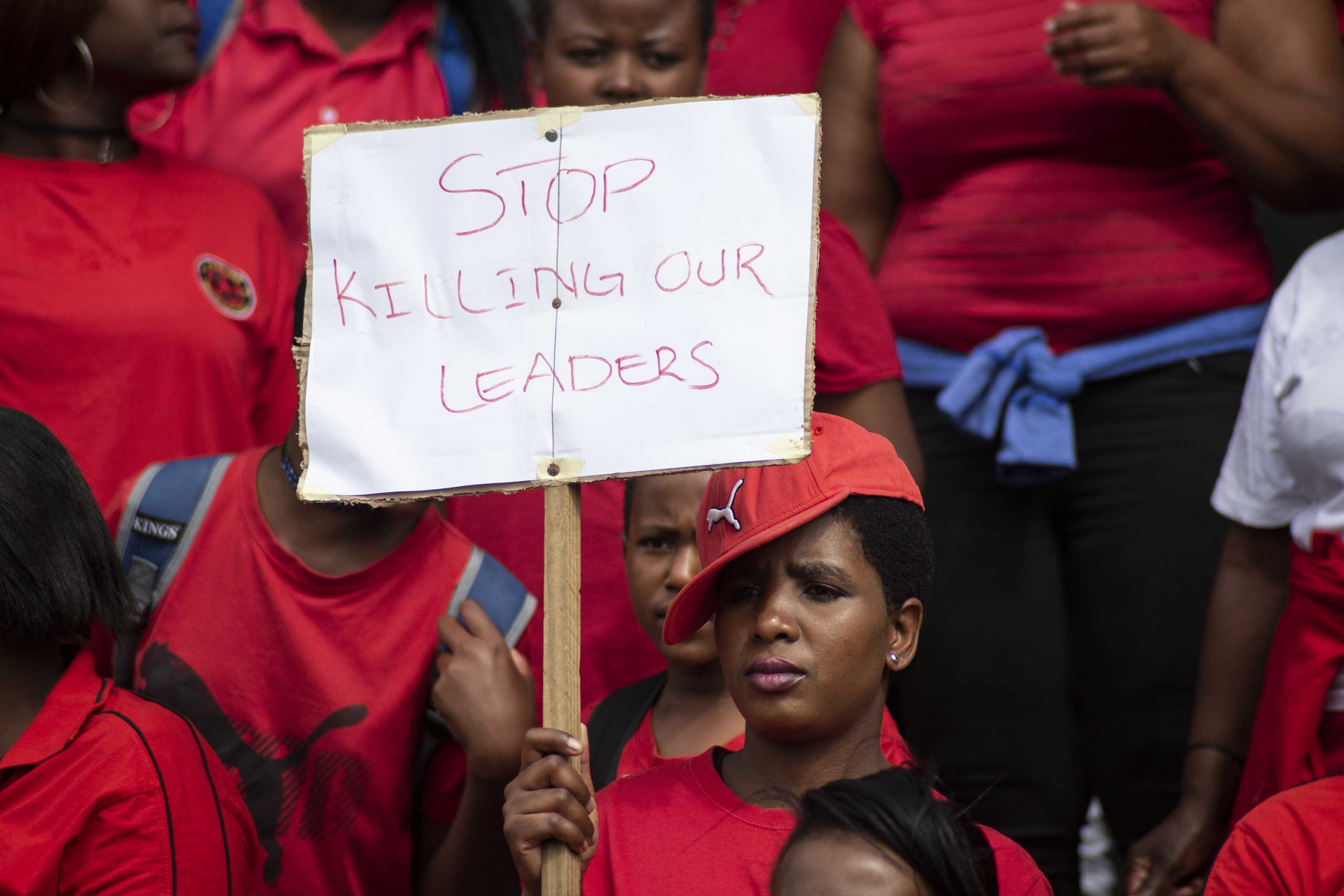 8 October 2018: Abahlali BaseMjondolo members gather at Curries Fountain before marching to City Hall. Durban came to a standstill as thousands marched in protest against politically motivated killings. (Photograph by Madelene Cronjé)