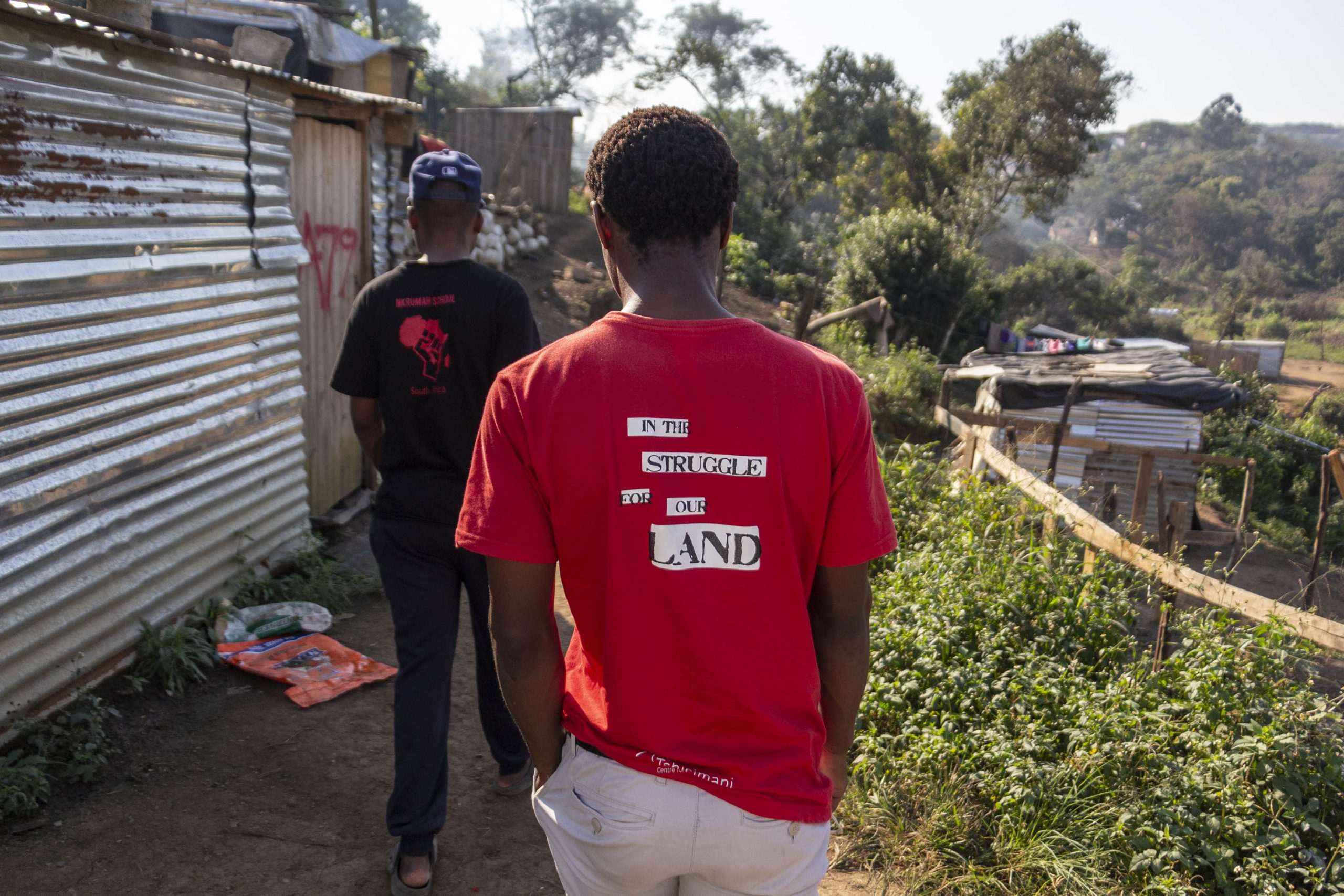 9 June 2020: The T-shirt of a man walking through the settlement of eKhenana reflects the residents’ struggle for a secure home from which they cannot be evicted.