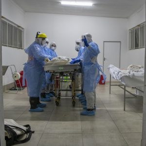 31 July 2020: Saaberie Chishty volunteers perform the ghusl, the Islamic rite of washing and shrouding, on the body of a man who died from Covid-19. Normally conducted by family, lockdown restrictions only allow trained volunteers to carry out this ritual.