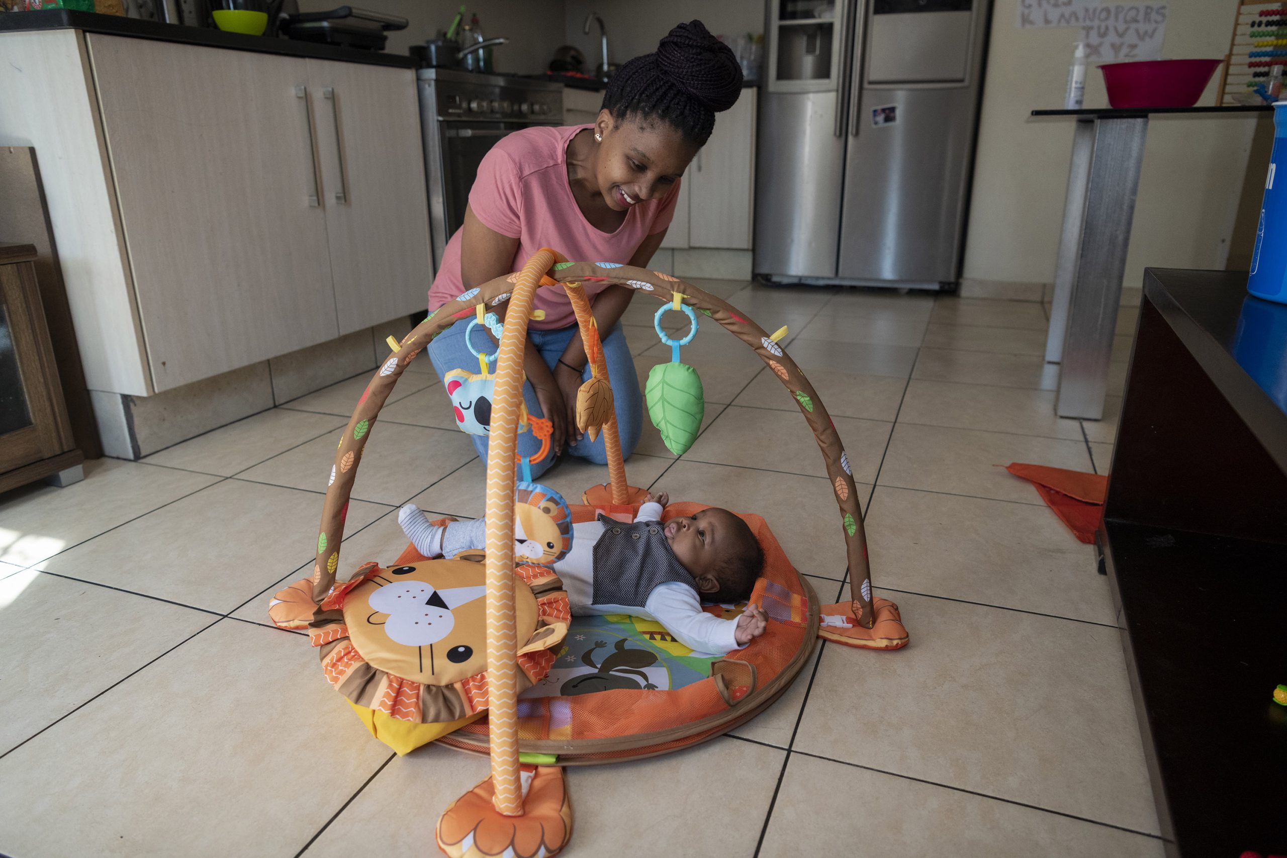 13 August 2020: Thembeka Sibiya plays with her newborn son Khaya. 