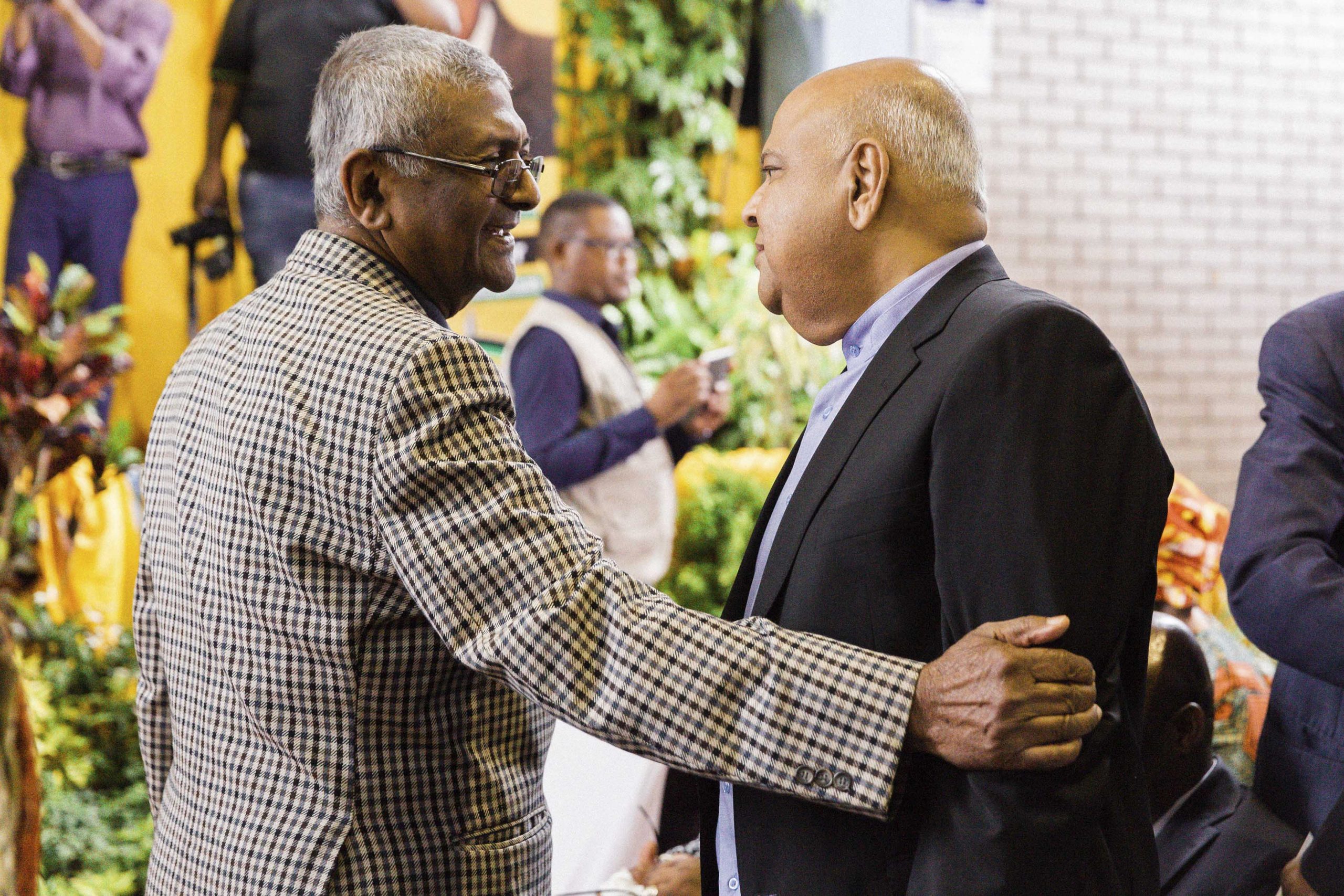 23 October 2016: Paul David talks to fellow struggle activist Pravin Gordhan at the funeral of ANC stalwart Mewa Ramgobin in Verulam, Durban. (Photograph by Rajesh Jantilal) 