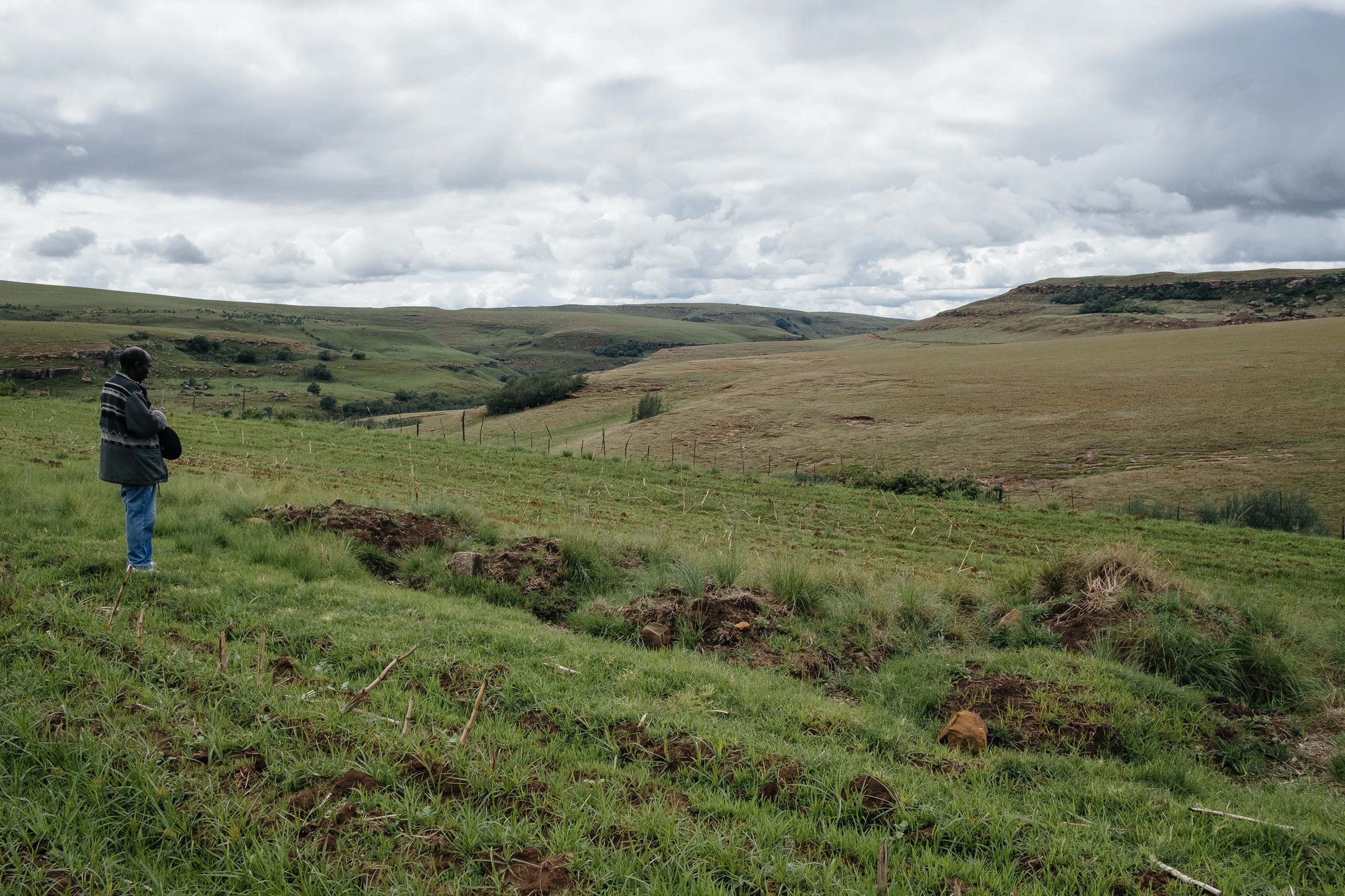 11 December 2019: George Nqoko pays respect to his ancestors at his family’s graves on Orla Farm. He worries that if they are no longer allowed in the area, the graves will be ploughed over. 