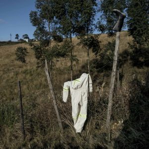 28 June 2013: Phumzile Sokanyile's washed overalls dry in the sun after his death at his home in Mdumazulu in Ngqeleni, Eastern Cape.